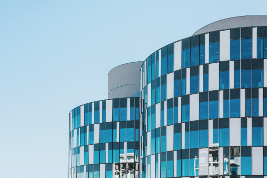 Exterior view of two business towers.